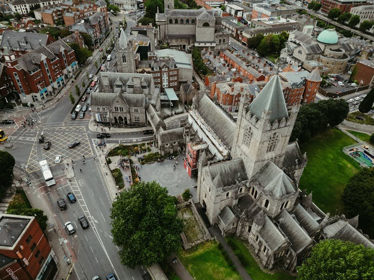 Stunning aerial shot of Dublin's Christ Church Cathedral, highlighting medieval architecture and cityscape.