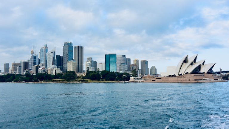 Stunning view of Sydney's skyline with the Opera House, capturing the essence of urban waterfront beauty.